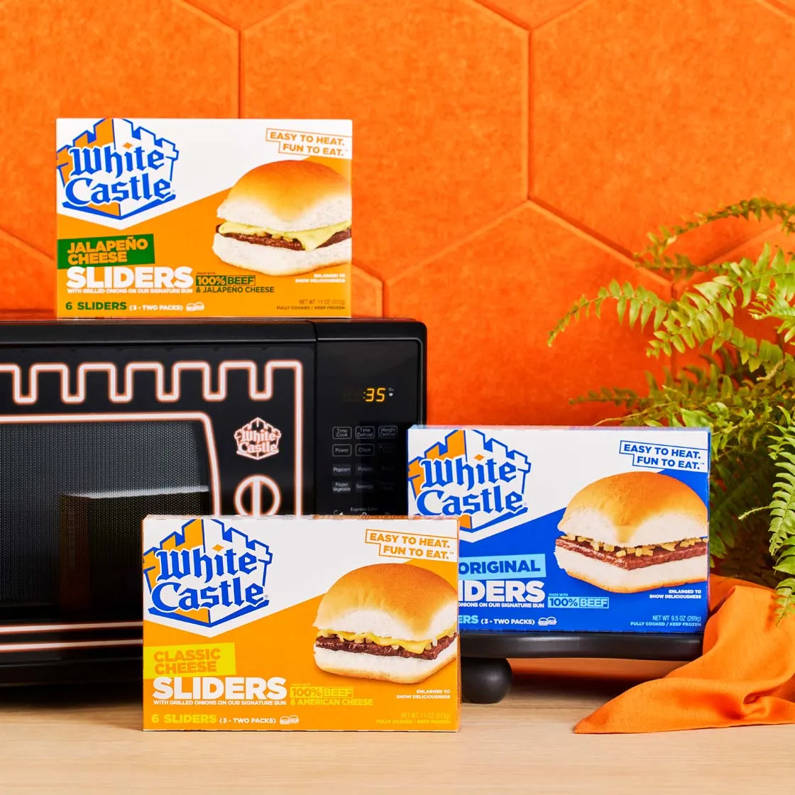 White Castle frozen sliders in front of a microwave on an orange set