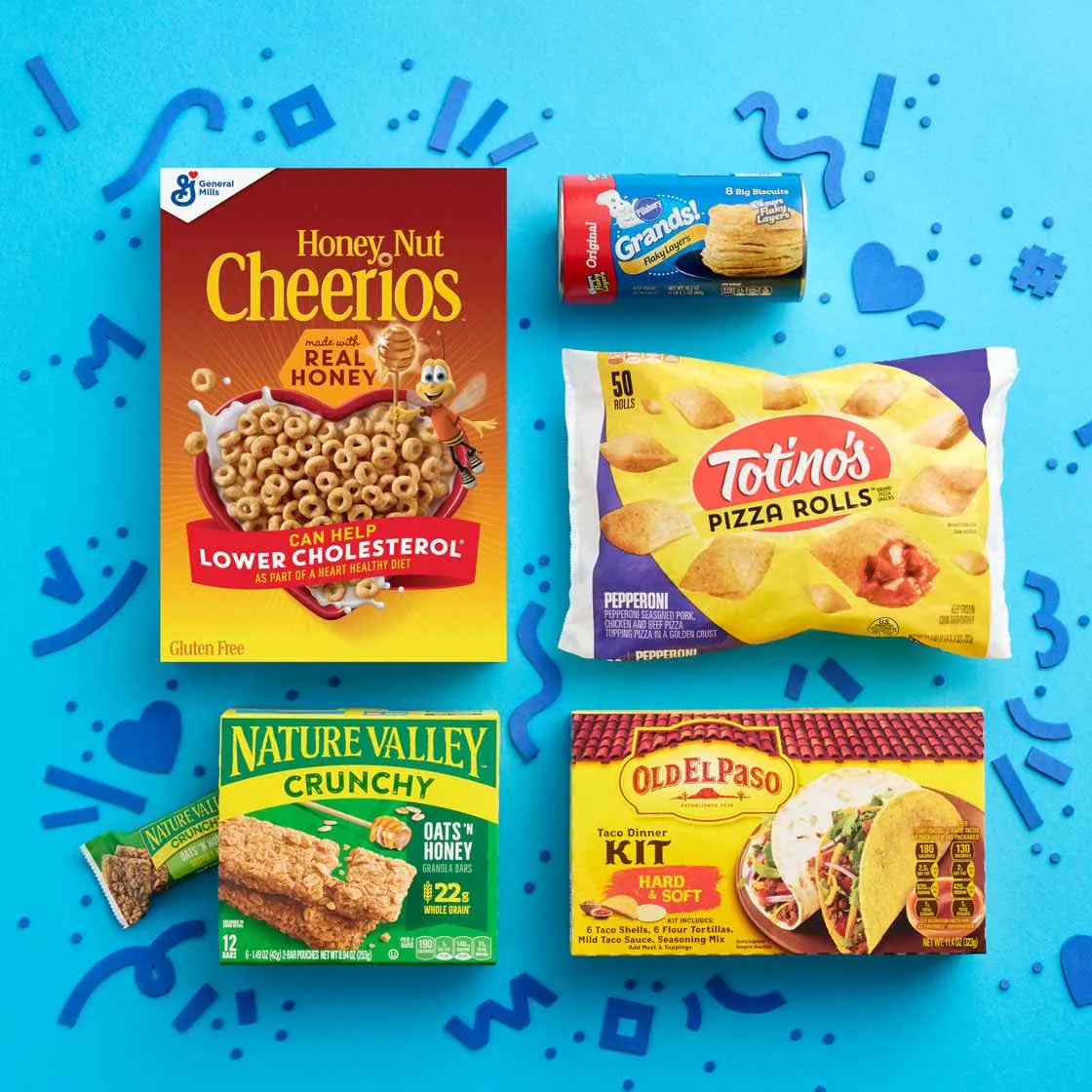 General Mills products laid out on a bright blue patterned backdrop